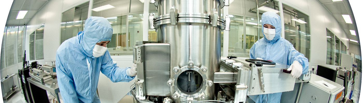 fisheye image of scientists working in a clean room