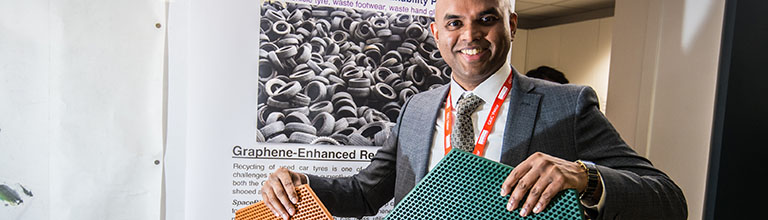 Vivek Koncherry, founder of Space Blue, holding graphene-enhanced rubber Space Mats, made from recycled tyres