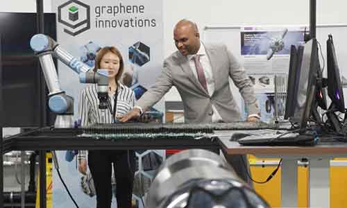 Man at a lab table laying out material