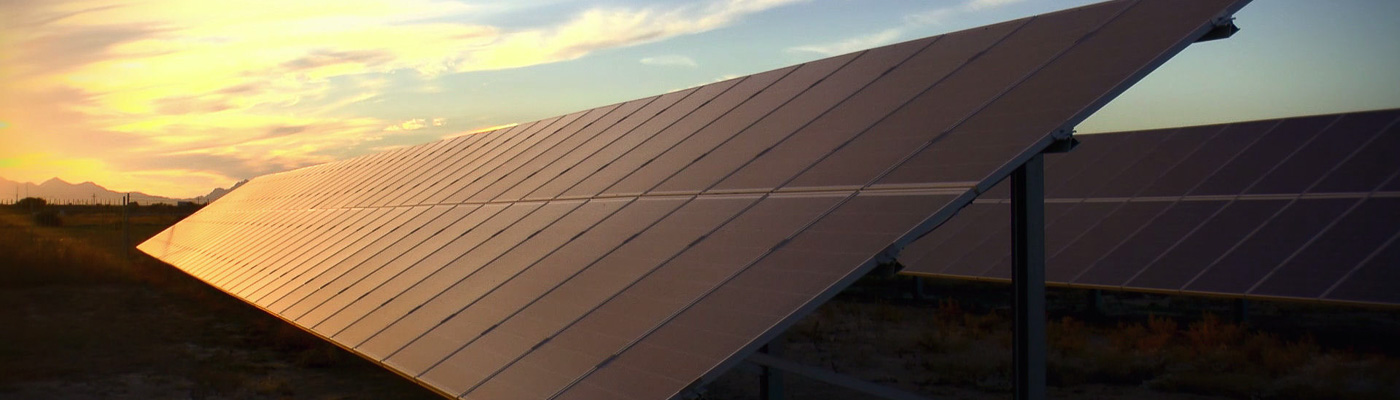 large solar panels at sunset