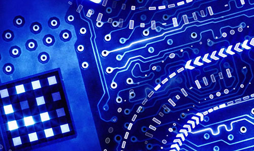 Predominantly blue, close-up image of an electronic circuit