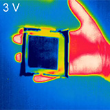 A handheld device displaying thermally adaptive camouflage