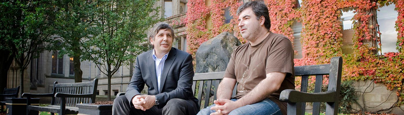 Andre Geim and Kostya Novoselov seated on a bench